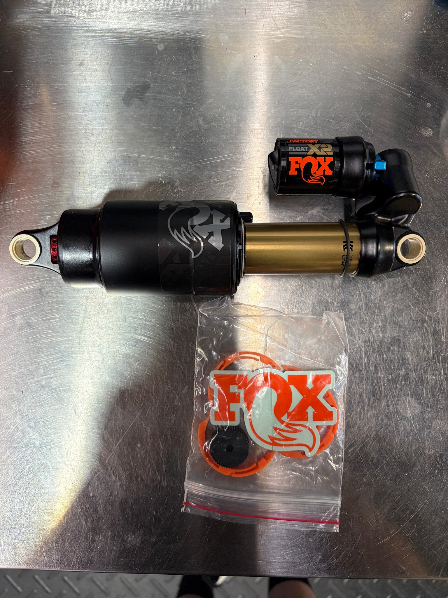 24/25 Float X2, F-S, K, 2-pos-Adj, FOX, SRV, 230-65, CX002, JCR010, Rezi BX001, Orange, Neutral logo, AM